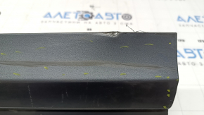 The lower front left door trim of the Audi Q3 8U 16-18 is worn and dented