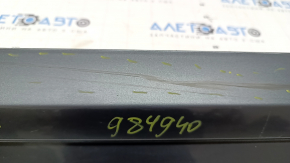 The lower front left door trim of the Audi Q3 8U 16-18 is worn and dented