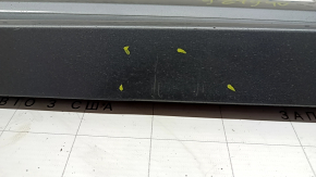 The lower front left door trim of the Audi Q3 8U 16-18 is worn and dented
