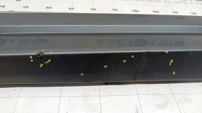 The lower front left door trim of the Audi Q3 8U 16-18 is worn and dented
