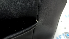 The upholstery of the driver's seat back of the VW Tiguan 18-21 is black leather, heated, with tears