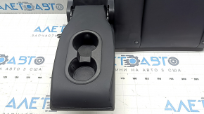 The back of the rear row of seats, left, Tesla Model 3 18-23, black leather, with a belt and heating, is wrinkled