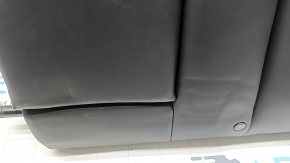 The back of the rear row of seats, left, Tesla Model 3 18-23, black leather, with a belt and heating, is wrinkled