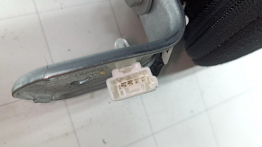 The back of the rear row of seats, left, Tesla Model 3 18-23, black leather, with a belt and heating, is wrinkled