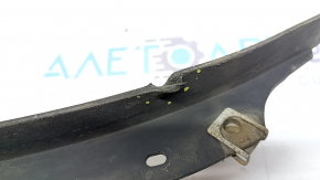 The left front bumper mudguard of the Audi A4 B8 08-16 is worn and dented