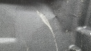 The trunk floor trim of the Mercedes X167 GLS 450 580 20-26 is black, torn, and needs dry cleaning