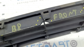 The central grille of the front bumper of the VW Passat b8 16-19 USA is chrome, cracked, fragments are missing