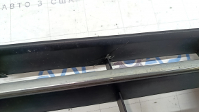 The central grille of the front bumper of the VW Passat b8 16-19 USA is chrome, cracked, fragments are missing