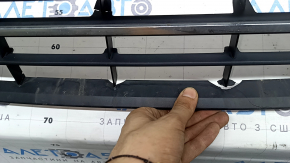 The central grille of the front bumper of the VW Passat b8 16-19 USA is chrome, cracked, fragments are missing
