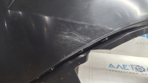 The rear bumper of a Toyota Sienna 21-26 is bent, scuffed, and the mount is broken