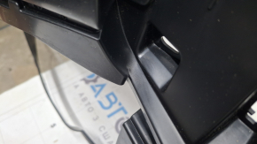 The rear bumper of a Toyota Sienna 21-26 is bent, scuffed, and the mount is broken