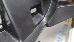 The rear bumper of a Toyota Sienna 21-26 is bent, scuffed, and the mount is broken