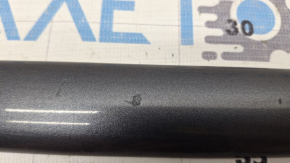 The front right central door molding of Toyota Camry v40 is chipped and the corner is broken