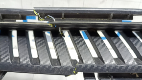 The upper grille of the front bumper of the Chevrolet Equinox EV 24-26 is broken in half, there is no fragment, there is a crack