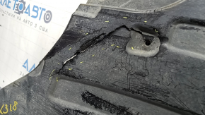 The rear right underbody protection of the BMW X3 G01 18-24 is torn, dented, missing a fragment