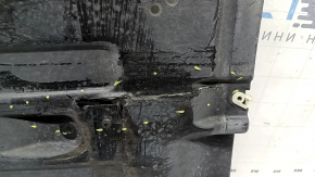 The rear right underbody protection of the BMW X3 G01 18-24 is torn, dented, missing a fragment