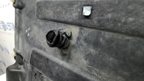 The rear right underbody protection of the BMW X3 G01 18-24 is torn, dented, missing a fragment