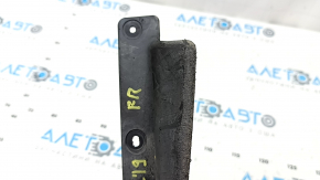 The right front bumper mudguard for a Jeep Cherokee KL 19-23 is worn, the mount is dented and bent