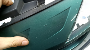 The radiator grille assembly for a Toyota Prius 50 Prime 17-19 with an emblem, under a radar, without parking sensors, cracked, chipped, and a broken mount