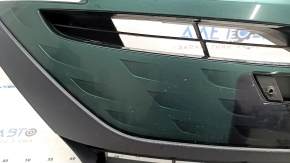 The radiator grille assembly for a Toyota Prius 50 Prime 17-19 with an emblem, under a radar, without parking sensors, cracked, chipped, and a broken mount