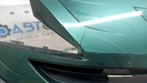 The radiator grille assembly for a Toyota Prius 50 Prime 17-19 with an emblem, under a radar, without parking sensors, cracked, chipped, and a broken mount
