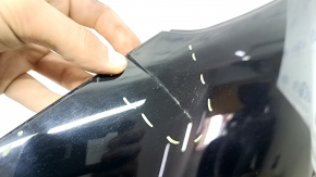 The right rear fender trim of a Toyota Prius 50 Prime 17-22 has peeling paint and is cracked