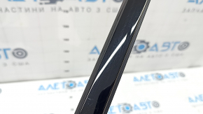 Molding door-glass central front left Audi Q3 83A 19-25 black gloss, worn, scratches