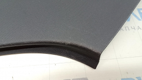 The rear pillar trim behind the right window of the Audi Q3 83A 19-25 is black, under the speaker, worn