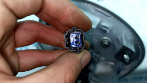 Emblem badge of the Hyundai Ioniq 17-19 trunk door under the camera, with a handle, a fragment of the button cover is missing
