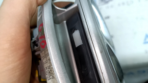 Emblem badge of the Hyundai Ioniq 17-19 trunk door under the camera, with a handle, a fragment of the button cover is missing