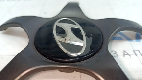 The center cap on the Hyundai Ioniq 17-19 HEV R17 wheel is crushed and the varnish is swollen