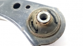 The lower front left control arm of a Toyota Prius 50 Prime 16-22 is rusty and the silent block is torn