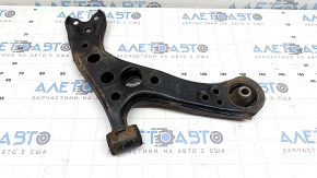 The lower front left control arm of a Toyota Prius 50 Prime 16-22 is rusty and the silent block is torn