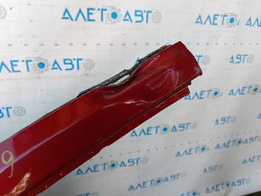 The front left quarter of a Toyota Prius 50 16-22 is sawn off with the central pillar, red, the pillar is dented