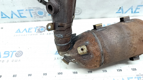 The inlet pipe with the catalytic converter of Nissan Rogue 21 2.5 has a torn corrugation and the catalytic converter is crushed