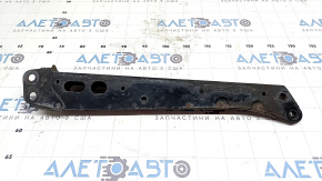 The front subframe reinforcement, left, Toyota Prius 30 10-15, is rusty