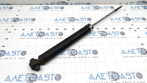 The rear left shock absorber of Toyota Prius 30 10-13 is dented and rusty