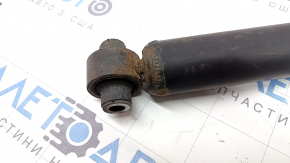 The rear left shock absorber of Toyota Prius 30 10-13 is dented and rusty