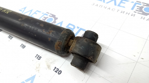 The rear right shock absorber of Toyota Prius 30 10-13 is dented and rusty