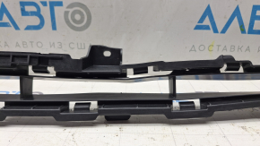 The front bumper central grille of the Kia Sportage 17-19 FWD is deformed
