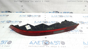 The left rear bumper light of the Audi Q5 80A 21-25 is worn and chipped