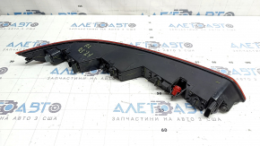 The left rear bumper light of the Audi Q5 80A 21-25 is worn and chipped
