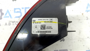 The left rear bumper light of the Audi Q5 80A 21-25 is worn and chipped