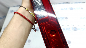 The left rear bumper light of the Audi Q5 80A 21-25 is worn and chipped