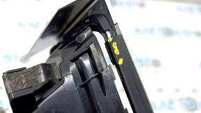 The front air duct deflector for the driver's side of the Audi A6 C7 16-18 is black, with a chrome trim, the trim fasteners are broken