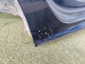 The quarter panel of the rear right wing of a VW Passat 20-22 was sawed off. Blue, with bumps