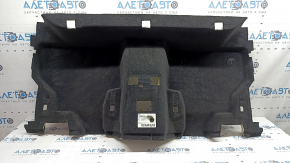 The rear floor covering of a BMW X3 F25 11-17 is black and needs cleaning. The foam rubber is torn and 2 mat fasteners are missing