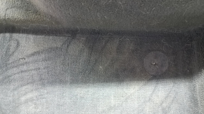 The rear floor covering of a BMW X3 F25 11-17 is black and needs cleaning. The foam rubber is torn and 2 mat fasteners are missing