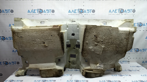 The rear floor covering of a BMW X3 F25 11-17 is black and needs cleaning. The foam rubber is torn and 2 mat fasteners are missing