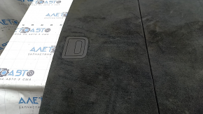 The trunk floor of the Audi Q8 19-26 is black, sooty, and worn